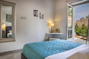 Postel nebo postele na pokoji v ubytování Aelia Cottage + 4 fotografie