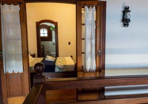Postel nebo postele na pokoji v ubytování Casarão Paraty