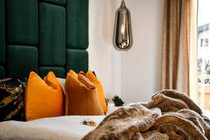 Łóżko lub łóżka w pokoju w obiekcie Boutique Hotel Pinzgauerhof