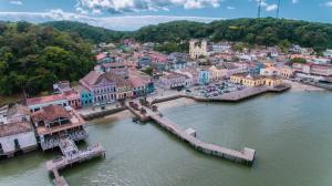 an aerial view of a town on the water at ApartPousada Residencial dos Reis in São Francisco do Sul