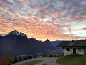 a house on the side of a road with mountains at Berghaus Alberta in Michelsberg