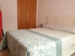 Posteľ alebo postele v izbe v ubytovaní Apartamento Porticada