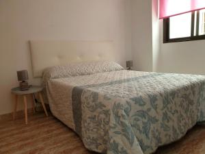Posteľ alebo postele v izbe v ubytovaní Apartamento Porticada