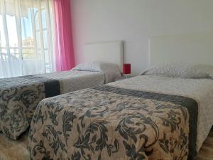 Posteľ alebo postele v izbe v ubytovaní Apartamento Porticada
