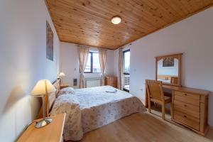 
A bed or beds in a room at Pearl Spa Apartments Pamporovo
