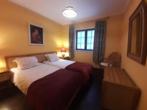 Postel nebo postele na pokoji v ubytování Cottage Sete Mares + 46 fotografií