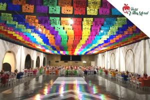 a large room with a large colorful ceiling at Hotel Villa Moral in Zacatlán