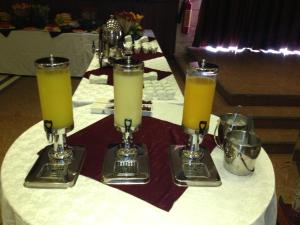 a table topped with two glasses of orange juice at Kanaan Group Hotel in Baalbeck +69 photos