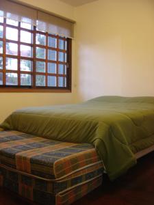 Posteľ alebo postele v izbe v ubytovaní GringsApsAluguel204