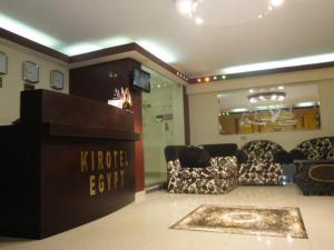 a store with two chairs and a table in a room at Kerotel Egypt in Cairo