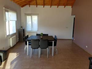 a dining room with a table and chairs at DEPARTAMENTO CALAFATE CENTRICO #3 in El Calafate +14 photos