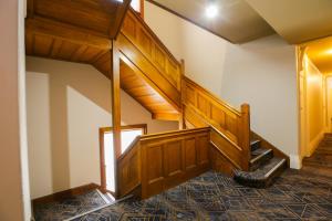 
a stair case in a room with a wooden floor at Hotel Gosford in Gosford
