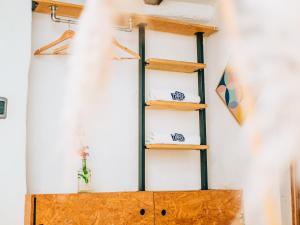 a shelf in a room with wooden shelves at Supertramp Hostel Cusco in Cusco