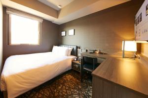Llit o llits en una habitació de hotel MONday Haneda Airport