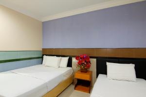 Postel nebo postele na pokoji v ubytování Cosy Inn