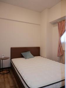 Llit o llits en una habitació de Maple Sumikawa #201
