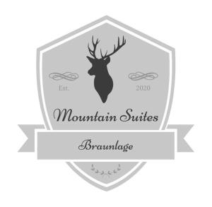 Mountain Suites Braunlage في برونلاغ: ملصق بمظلة غزال