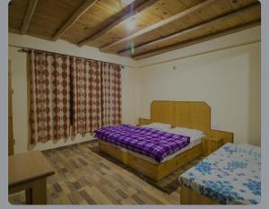 Ένα ή περισσότερα κρεβάτια σε δωμάτιο στο The Paradise, Old Manali +19 φωτογραφίες