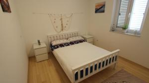 Postel nebo postele na pokoji v ubytování Apartment Lily