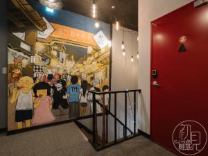 a mural in a hallway with a red door at CJ Hotel in Taipei