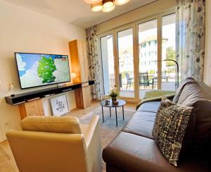 TV a/nebo společenská místnost v ubytování Ferienwohnung Vier Jahreszeiten mi