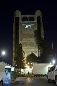 a large building with the word spa on it at night at Pearl Continental Hotel, Karachi in Karachi