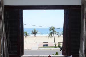 a view of the beach from a window at DTC Hotel in Da Nang