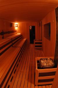 a dimly lit room with a wooden floor at Avshar Hotel Resort in Krasnogorsk