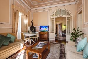 a living room with a couch and a table at Casa Beny 1897 Guesthouse in Loulé