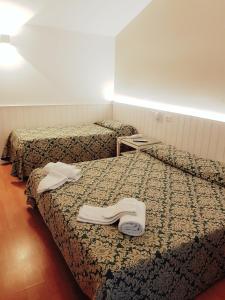 Postel nebo postele na pokoji v ubytování Hotel Degli Olmi