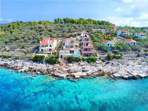 an aerial view of a resort on the water at Villa Kamen Blue in Vela Luka