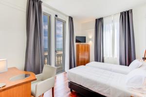 Кровать или кровати в номере Kursaal Hotel