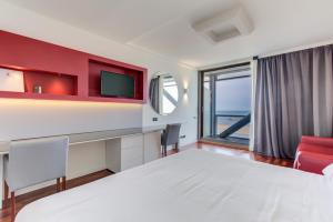 Кровать или кровати в номере Kursaal Hotel