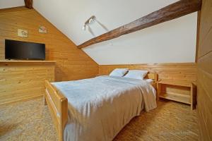 Postel nebo postele na pokoji v ubytování ferme st martin