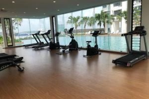 a gym with a row of exercise bikes in a building at HomestayBABA close to UKM, GMI, & more ! in Kajang