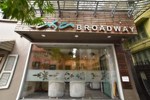 a store front of a building with a sign on it at Casa Broadway-A Boutique Hotel in Kolkata