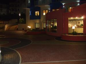 a night view of a building at night at Tus'Hotel in Castel di Tusa