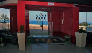 an entrance to a building with a glass door at Tus'Hotel in Castel di Tusa