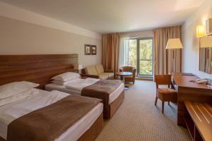 Postel nebo postele na pokoji v ubytování Hotel Trakošćan