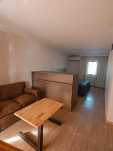 a living room with a couch and a table at BLU APARTMENTS in San Rafael