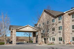a large brick building with a large stone arch at Comfort Inn Fort Collins North in Fort Collins