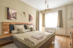 a bedroom with a large bed in a room at Elegant & Stylish 2 Bedroom Top Central Apartment in Sofia