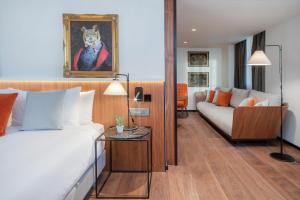 Postel nebo postele na pokoji v ubytování The Level at Melia White House