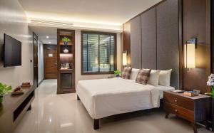 Ein Bett oder Betten in einem Zimmer der Unterkunft Khanom Beach Resort And Spa