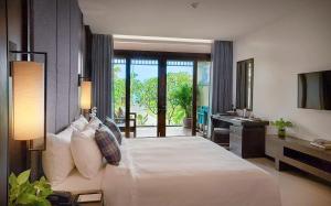Ein Bett oder Betten in einem Zimmer der Unterkunft Khanom Beach Resort And Spa