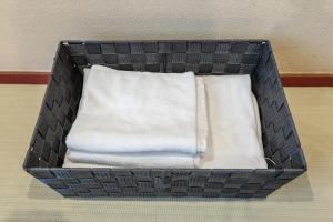 a box with two white pillows in a room at Seiki Kyoto Station in Kyoto