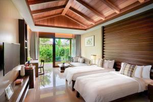Ein Bett oder Betten in einem Zimmer der Unterkunft Khanom Beach Resort And Spa