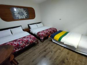 Katil atau katil-katil dalam bilik di Jilufugan B&B