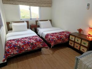 Katil atau katil-katil dalam bilik di Jilufugan B&B