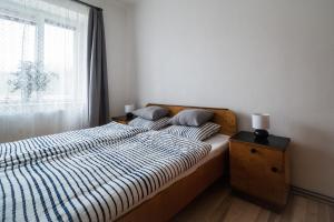 Posteľ alebo postele v izbe v ubytovaní Ubytování na Dobro-družném statku